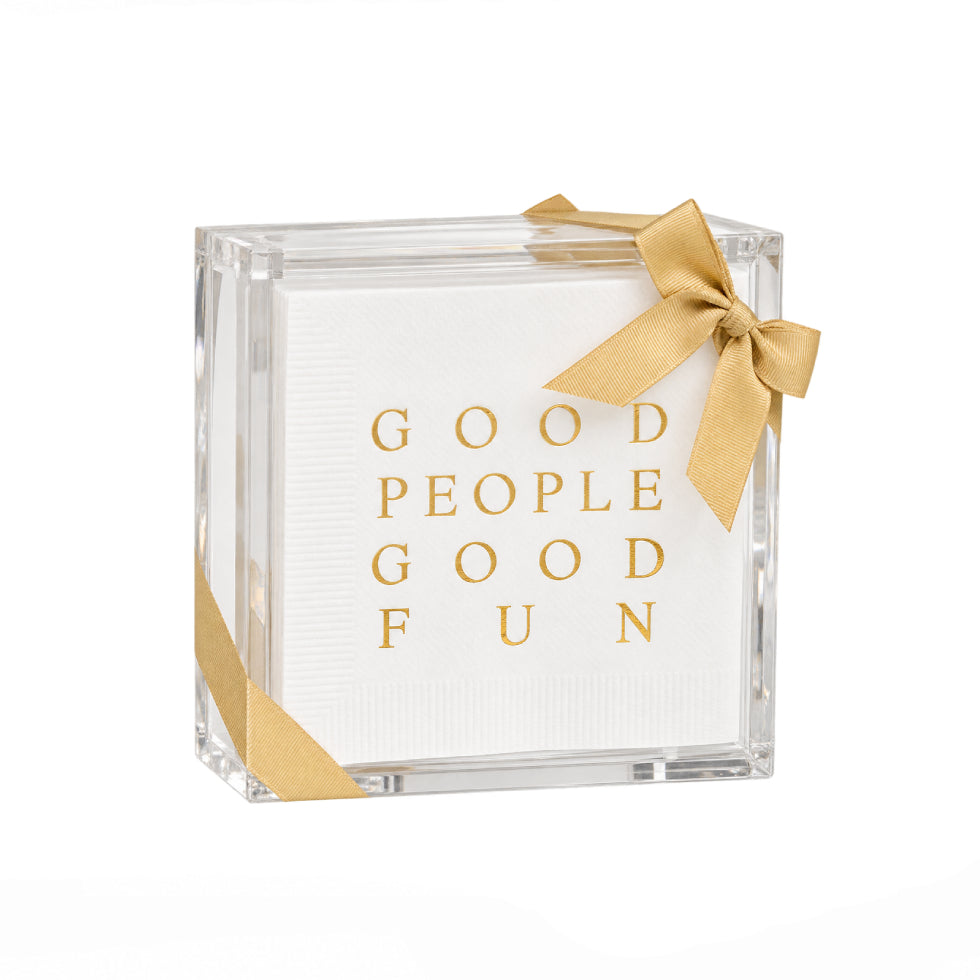 A square clear acrylic gift box containing a white textured paper insert with the words 'GOOD PEOPLE GOOD FUN' in gold lettering, tied with a gold ribbon bow on a white background.