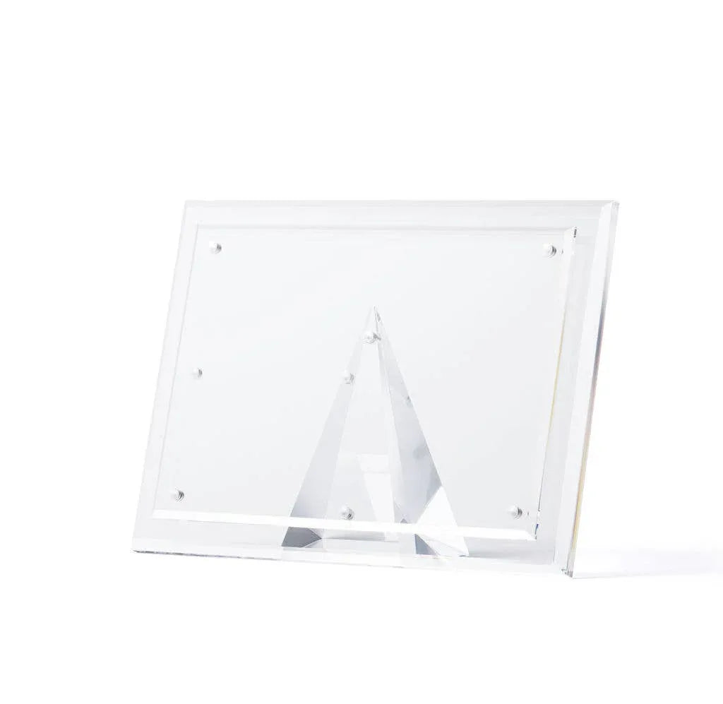 Hand-cut beveled acrylic picture frame with a magnetic pyramid stand on a white background
