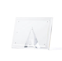 Hand-cut beveled acrylic picture frame with a magnetic pyramid stand on a white background