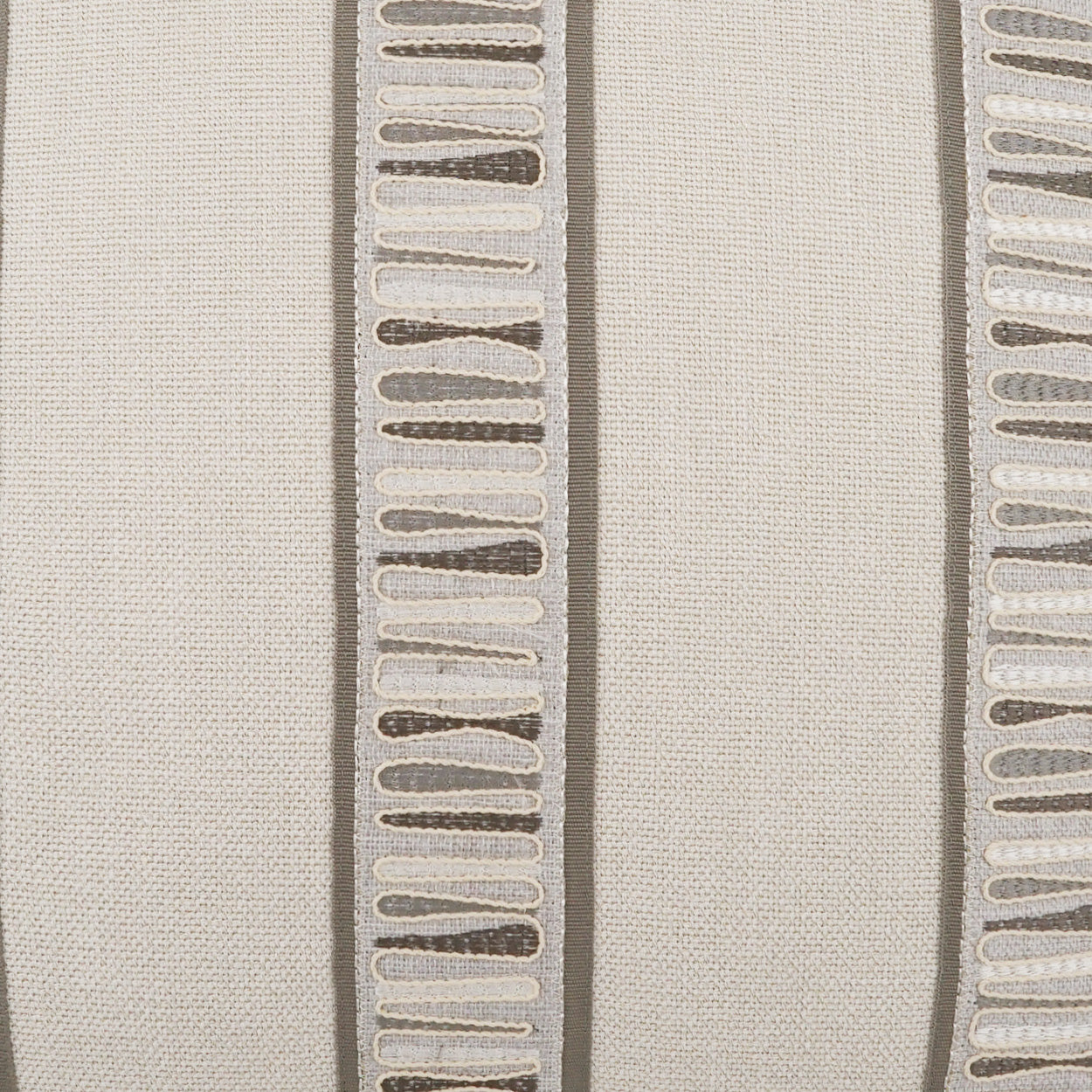 Textured fabric with a pattern of raised lines on a neutral background