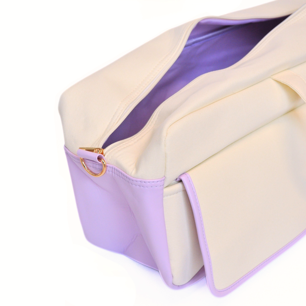 Beige and purple bag with a gold clasp on a white background