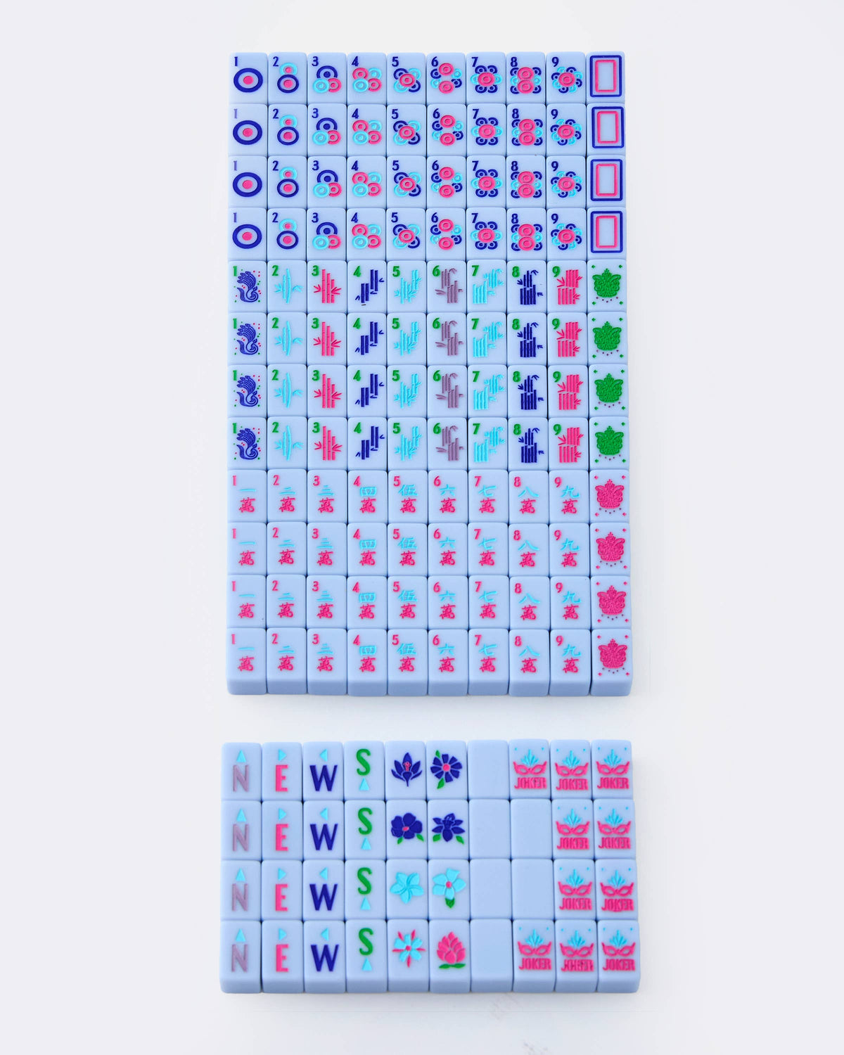 Set of colorful mahjong tiles with various designs on a white background