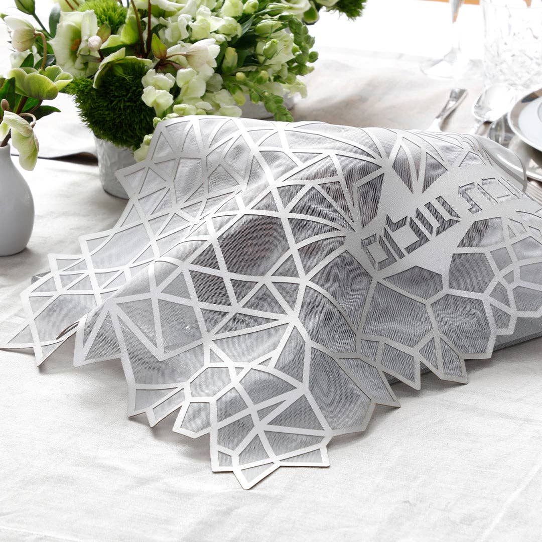 Geometric Challah Silver Cover displayed on a table. 