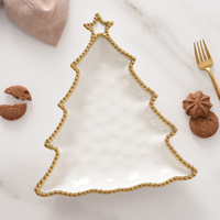 White porcelain Christmas Tree Platter with gold beaded trim. 
