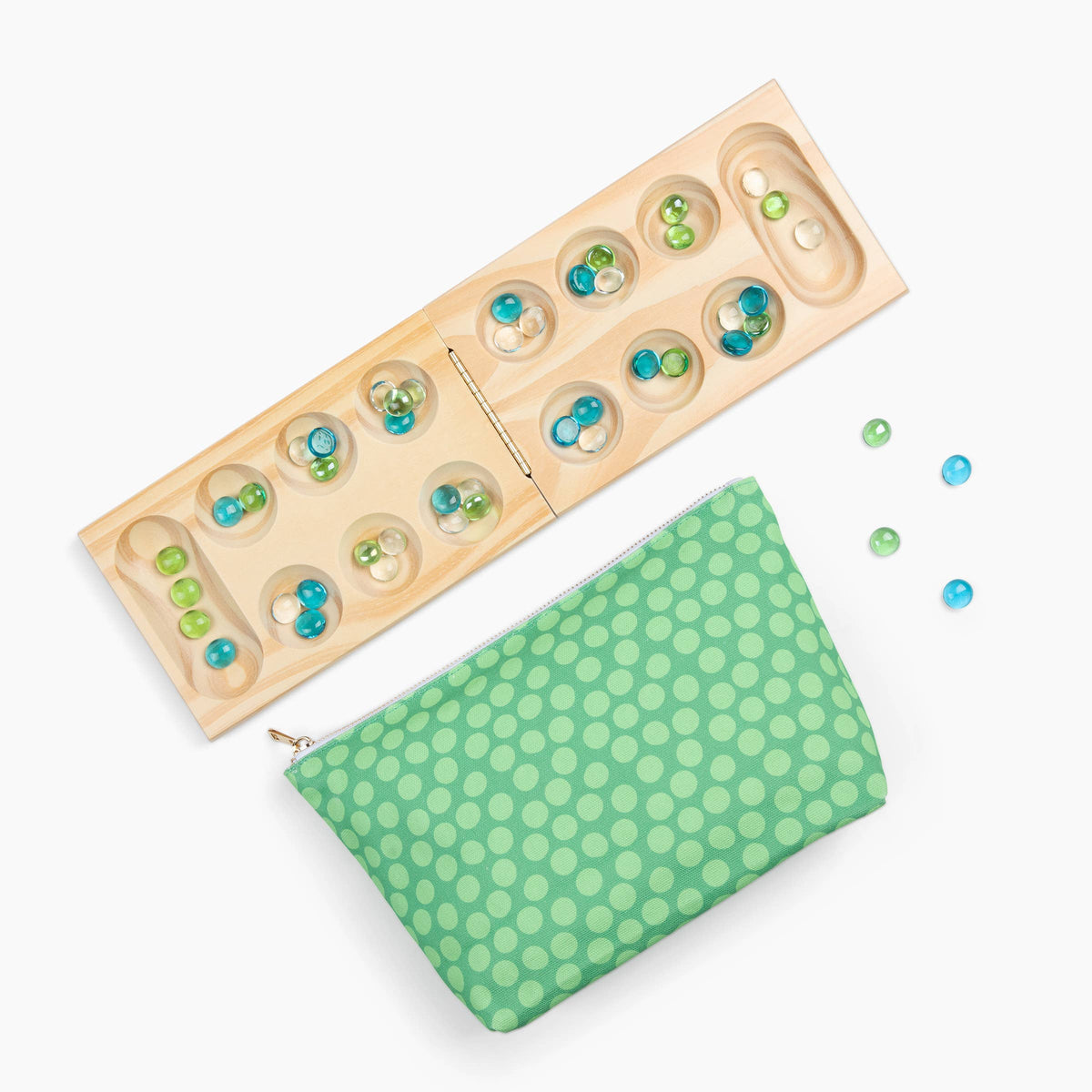 Wooden puzzle with colored beads and a green polka dot pouch on a white background
