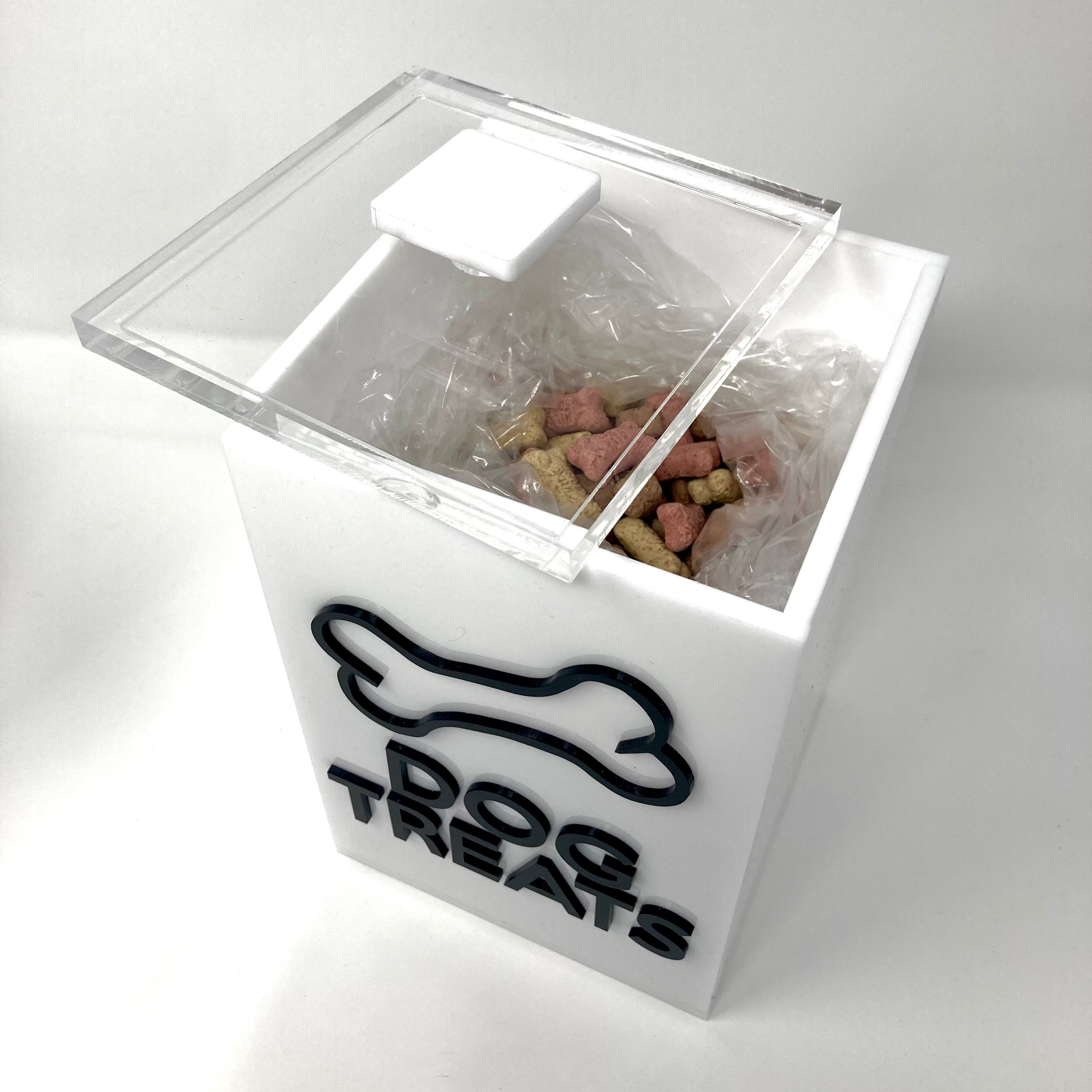 Clear treat jar with 'Dog Treats' label on a white background