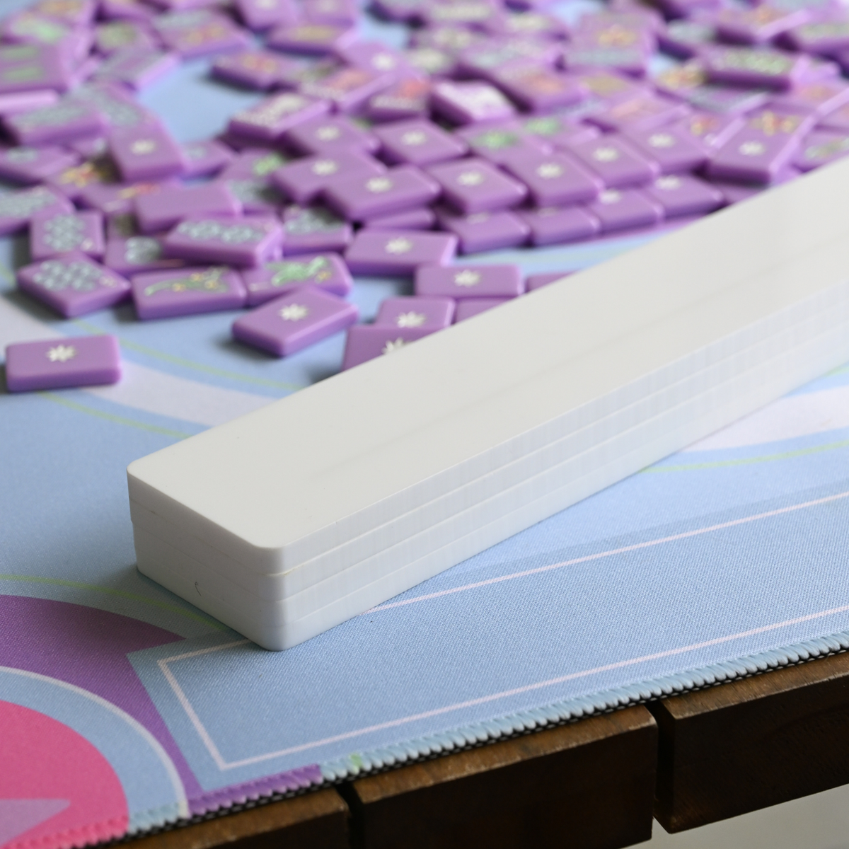 White rectangular block on a colorful foam mat