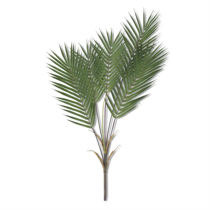Artificial palm leaf branch on a white background real touch