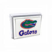 A stack of white napkins wrapped in clear plastic, featuring the Florida Gators logo and wordmark printed on the front.