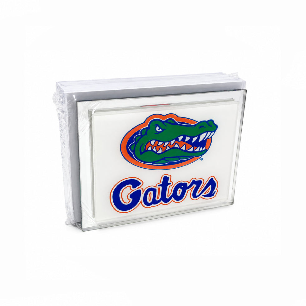 A stack of white napkins wrapped in clear plastic, featuring the Florida Gators logo and wordmark printed on the front.