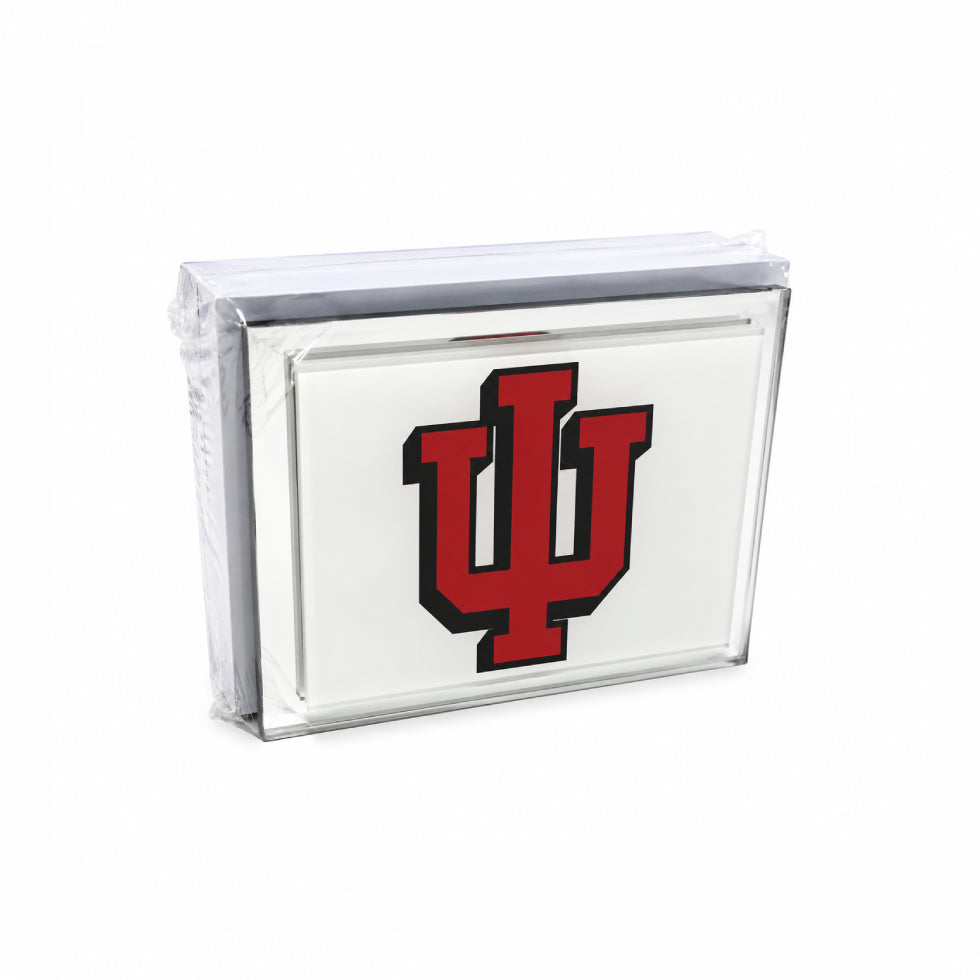 A clear acrylic block sign featuring the red and black Indiana University 'IU' logo on a white background, wrapped in protective plastic.