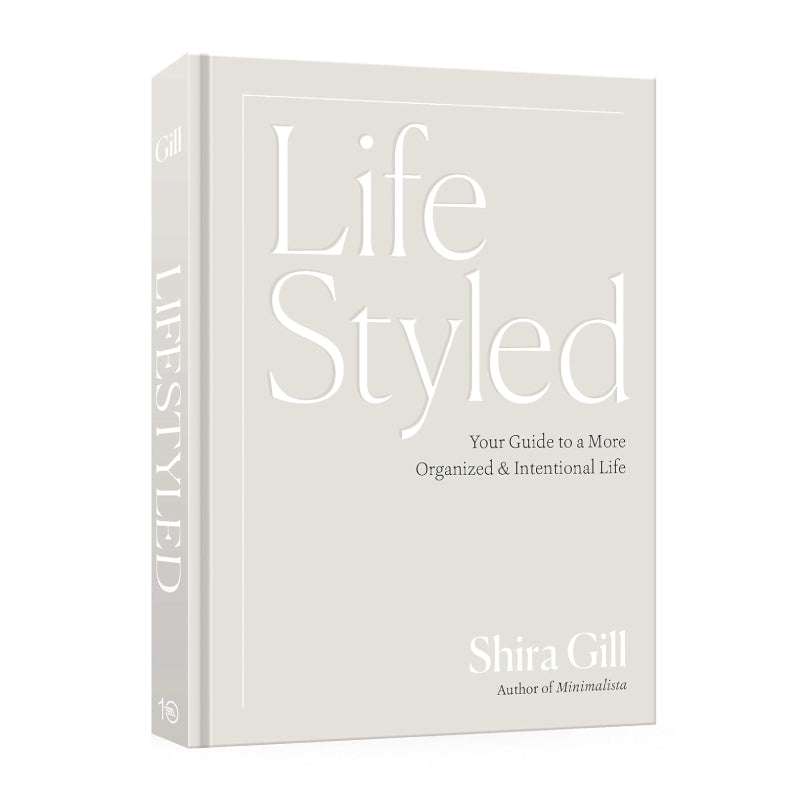 The book 'Life Styled' by Shira Gill, featuring a minimalist off-white cover with elegant white typography and a matching spine, shown on a clean white background.