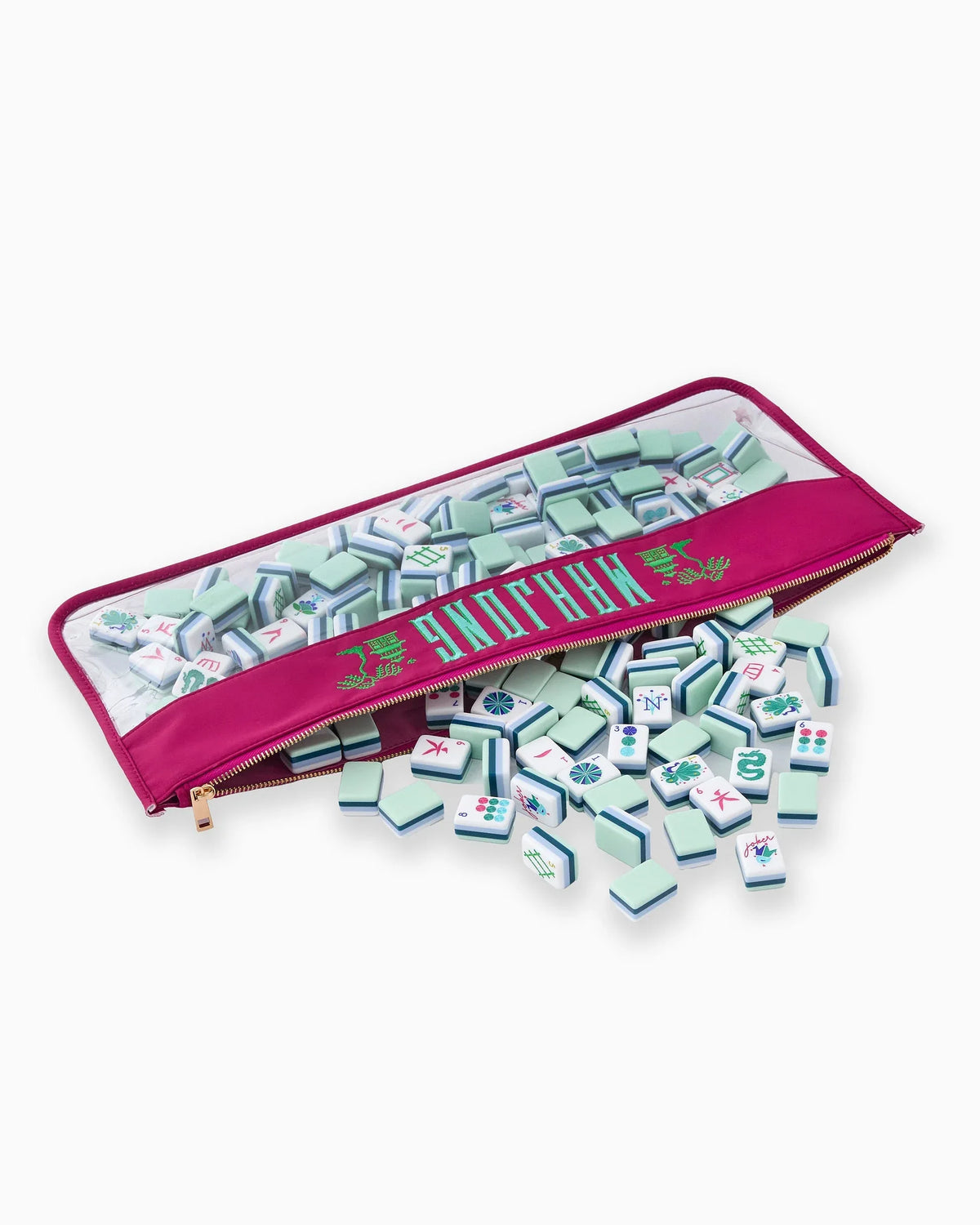Set of miniature mahjong tiles with a carrying case on a white background