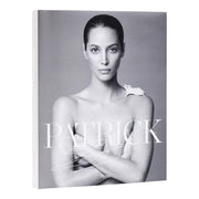 Book cover with a black and white portrait of a woman and the brand 'Patrick' on a gray background.