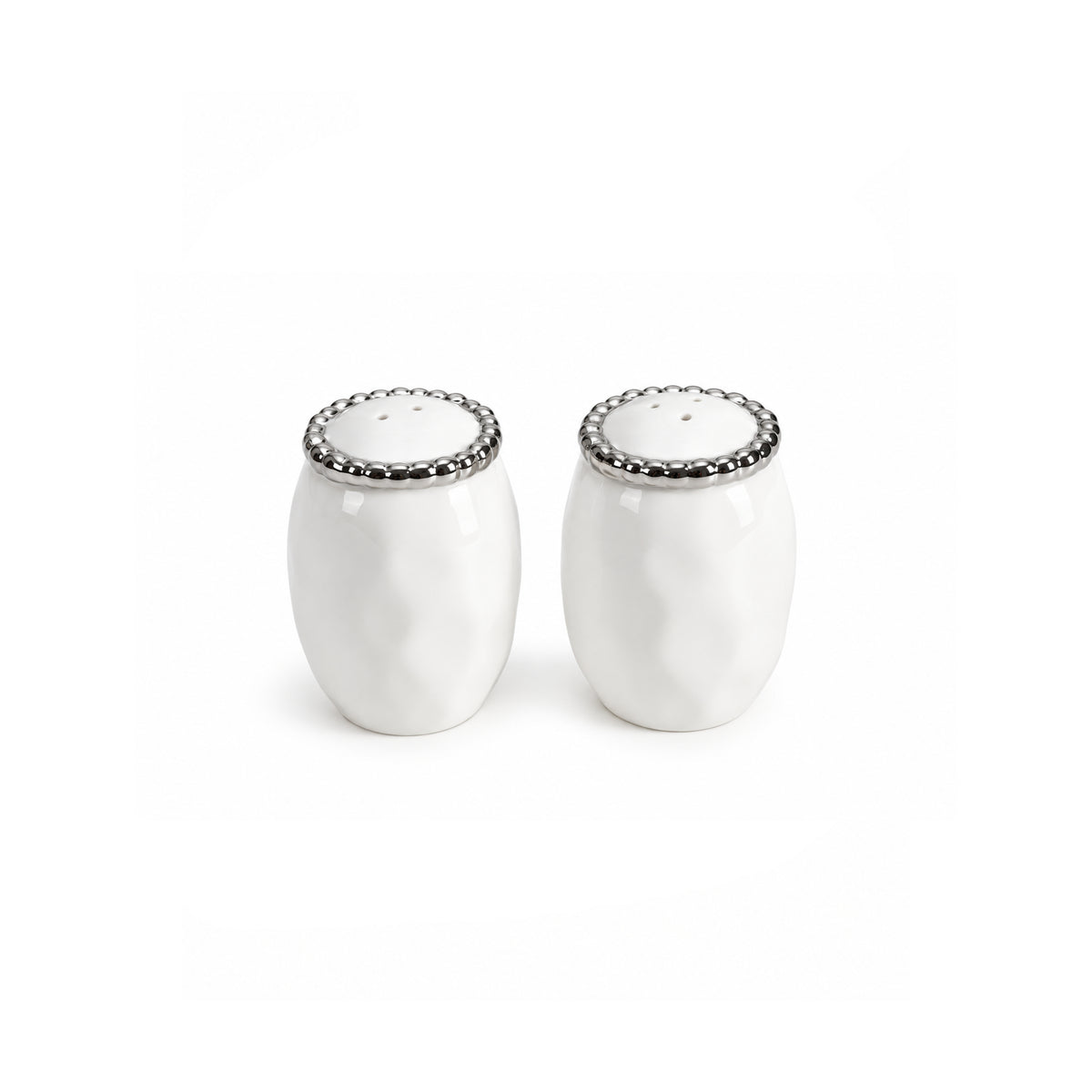A pair of white ceramic salt and pepper shakers with textured bodies and silver-toned scalloped metal lids, shown on a plain white background.