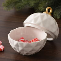 Small Ornament Bowl with gold top and candies inside. 