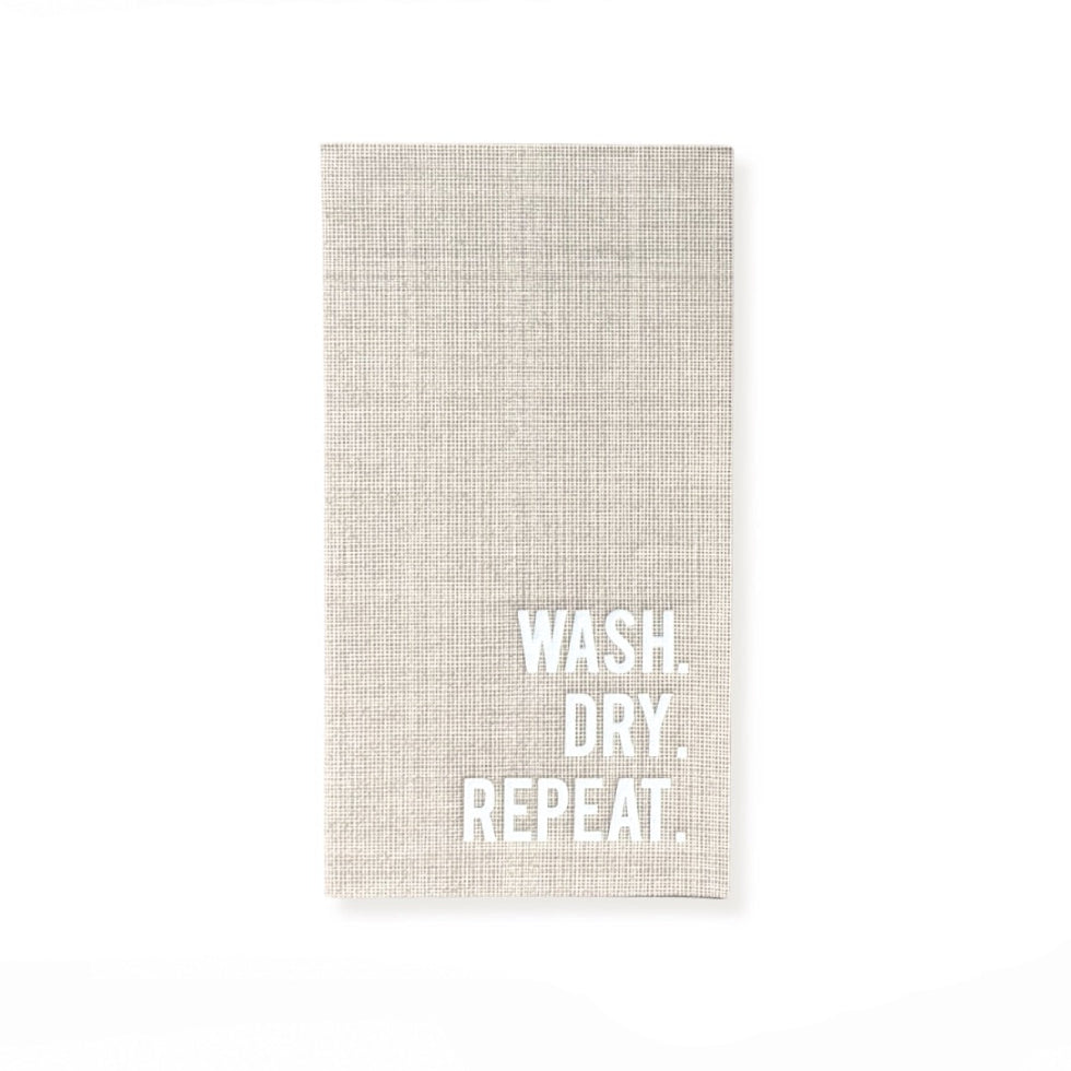 A rectangular beige linen kitchen towel with the words 'WASH. DRY.